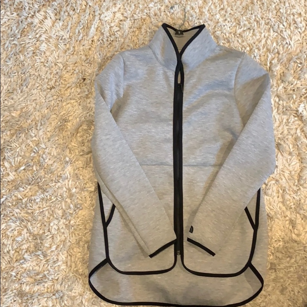 The North Face zip up jacket.